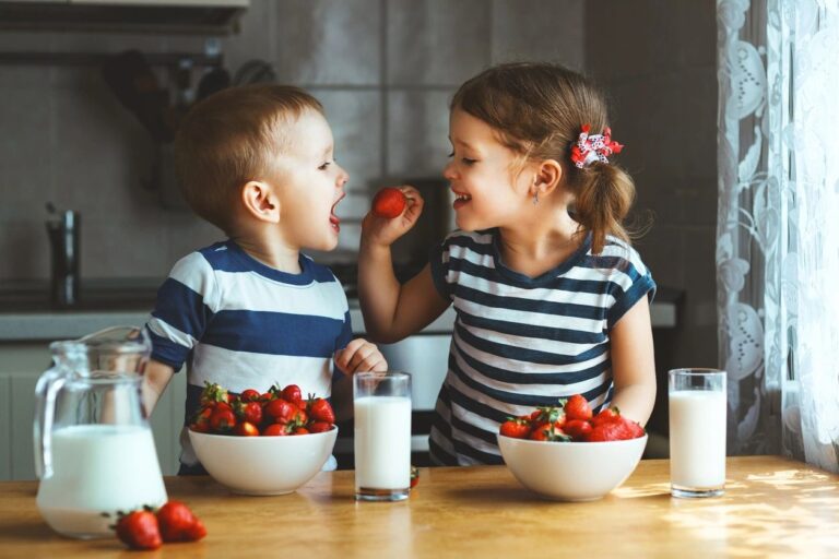 Child at the table during a feeding therapy session in the Tumble N' Dots clinic kitchen in Irvine