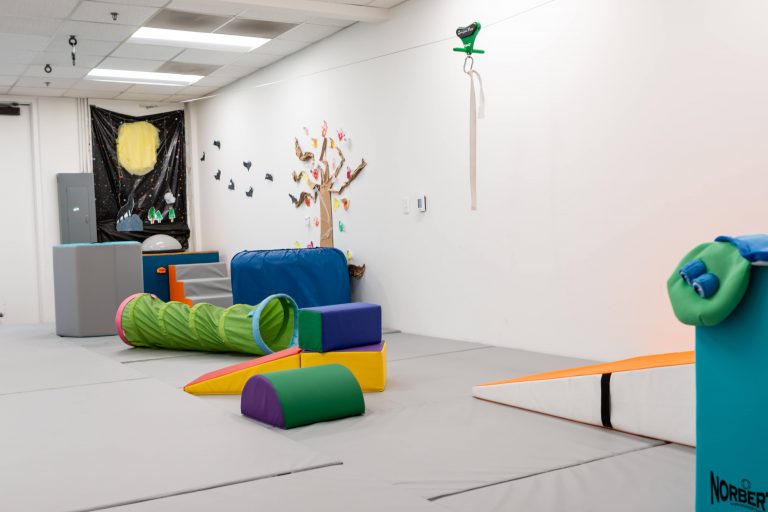 Foam obstacle course laid out across the sensory gym floor